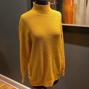 Express gold lightweight soft long mock turtleneck. Acrylic/nylon/spandex blend.